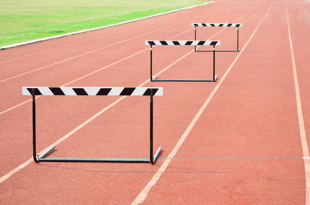 3 hurdles on the track to represent Sales Leadership Barriers to Success