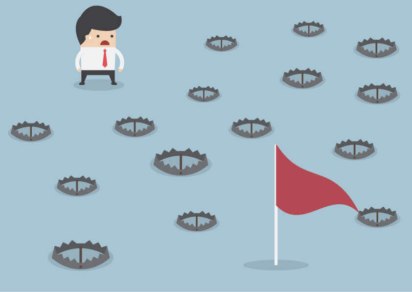 Graphic of a sales rep with sales traps on the way to his goal as he tries to Avoid Sales Obstacles